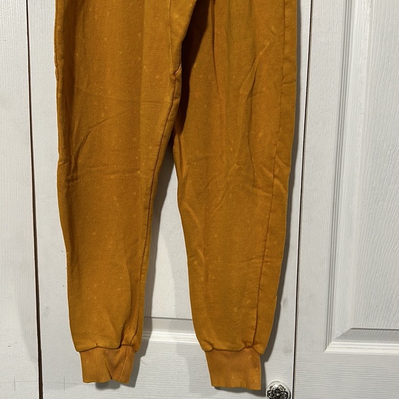 Mustard Urban Outfitters Puffy Pants with light bleach spots. - Picture 9 of 9